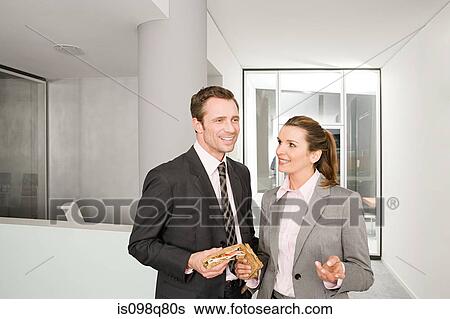 Colleagues with sandwiches View Large Photo Image Stock Photograph - Colleagues with sandwiches. Fotosearch