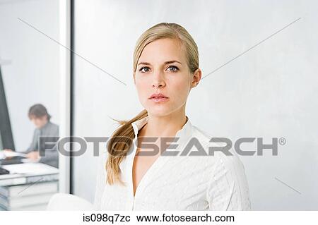Stock Image - Woman in office. Fotosearch