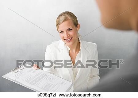 Woman with form on clipboard View Large Photo Image Stock Photograph - Woman with form on clipboard. Fotosearch