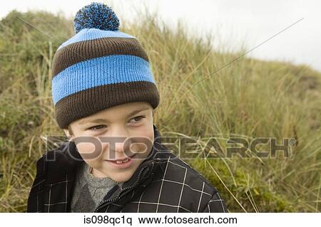 Boy wearing bobble hat View Large Photo Image Stock Photography - Boy wearing bobble hat. Fotosearch