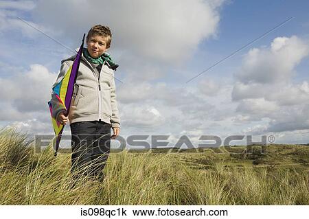 Boy with a kite View Large Photo Image Stock Image - Boy with a kite. Fotosearch