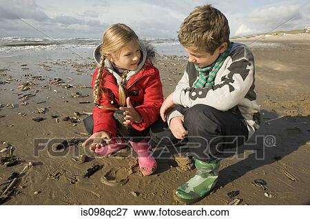 Brother and sister at the beach View Large Photo Image Stock Photo - Brother and sister at the beach. Fotosearch