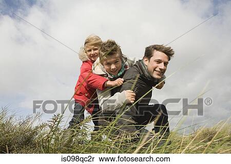 Children and father outdoors View Large Photo Image Stock Photography - Children and father outdoors. Fotosearch