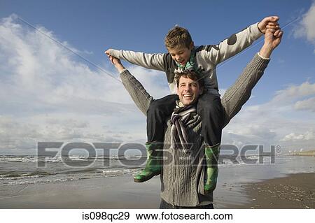 Stock Photo - Father and son by the sea. Fotosearch