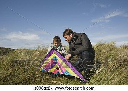 Father and son with kite View Large Photo Image Stock Image - Father and son with kite. Fotosearch
