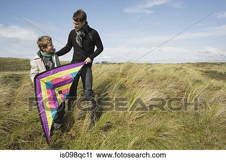 Father and son with kite View Large Photo Image Stock Photograph - Father and son with kite. Fotosearch