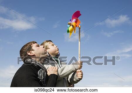 Father and son with pinwheel View Large Photo Image Picture - Father and son with pinwheel. Fotosearch