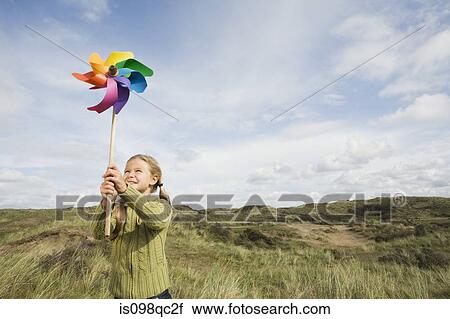 Girl with a pinwheel View Large Photo Image Stock Image - Girl with a pinwheel. Fotosearch