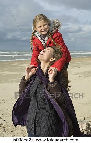 Mother and daughter at the beach View Large Photo Image Stock Photo - Mother and daughter at the beach. Fotosearch