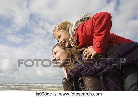 Mother and daughter by the sea View Large Photo Image Stock Photo - Mother and daughter by the sea. Fotosearch