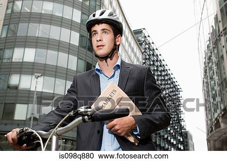 Businessman with bicycle View Large Photo Image Stock Image - Businessman with bicycle. Fotosearch