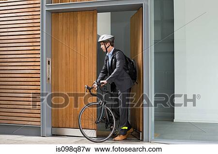 Businessman with bicycle View Large Photo Image Stock Photo - Businessman with bicycle. Fotosearch