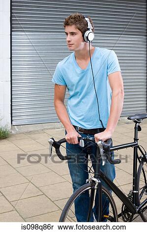 Cyclist wearing headphones View Large Photo Image Stock Photography - Cyclist wearing headphones. Fotosearch