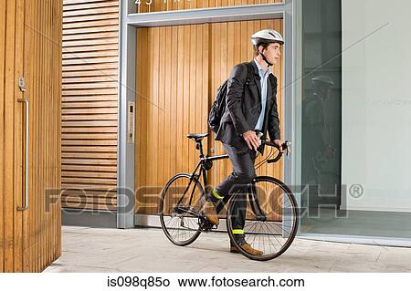 Man riding bicycle View Large Photo Image Picture - Man riding bicycle. Fotosearch