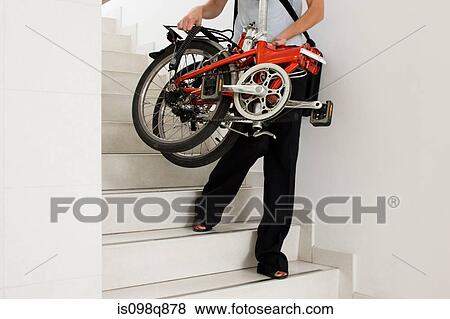 Person in office with bike View Large Photo Image Stock Photo - Person in office with bike. Fotosearch