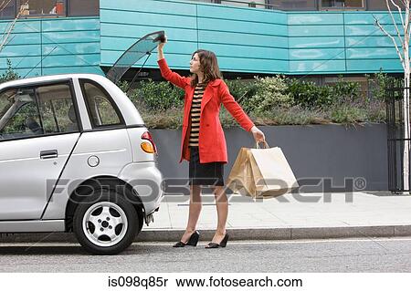 Woman by car with shopping bags View Large Photo Image Stock Photography - Woman by car with shopping bags. Fotosearch