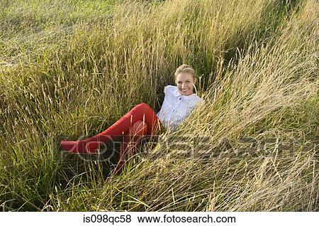 Woman in a field View Large Photo Image Stock Photo - Woman in a field. Fotosearch
