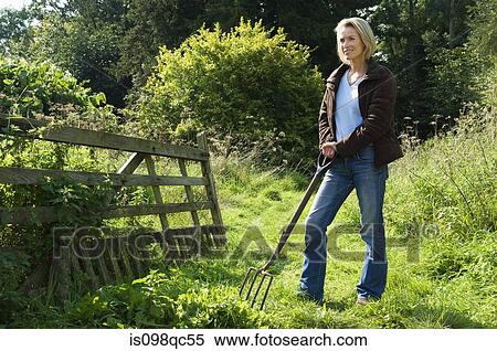 Woman with pitchfork View Large Photo Image Stock Photography - Woman with pitchfork. Fotosearch