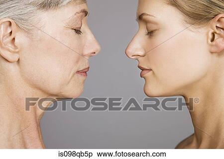 Young and senior women face to face View Large Photo Image Stock Photography - Young and senior women face to face. Fotosearch