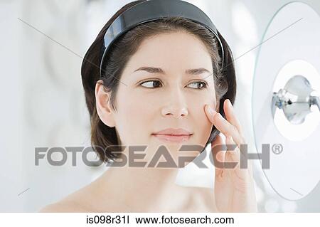 Woman looking in mirror View Large Photo Image Stock Image - Woman looking in mirror. Fotosearch