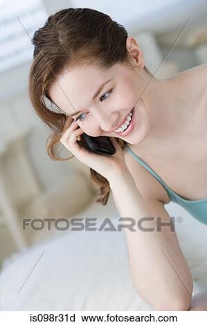 Woman on cellphone View Large Photo Image Stock Image - Woman on cellphone. Fotosearch