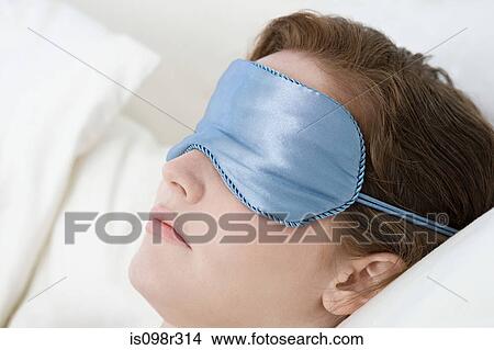 Woman wearing eye mask View Large Photo Image Picture - Woman wearing eye mask. Fotosearch