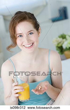 Woman with juice and vitamins View Large Photo Image Stock Image - Woman with juice and vitamins. Fotosearch