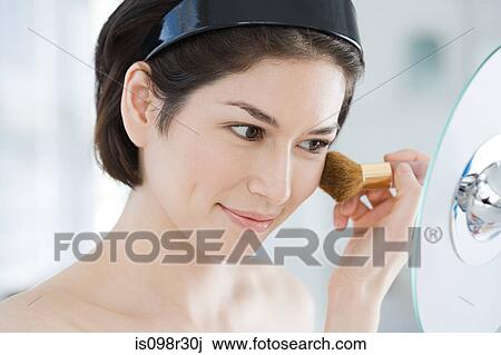 Young woman applying make up View Large Photo Image Stock Image - Young woman applying make up. Fotosearch