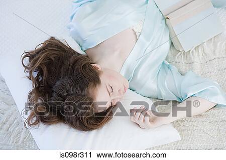 Young woman sleeping View Large Photo Image Stock Image - Young woman sleeping. Fotosearch