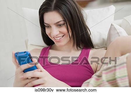 Young woman with cellphone View Large Photo Image Stock Photo - Young woman with cellphone. Fotosearch