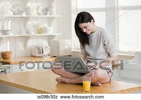 Young woman with laptop View Large Photo Image Stock Photo - Young woman with laptop. Fotosearch