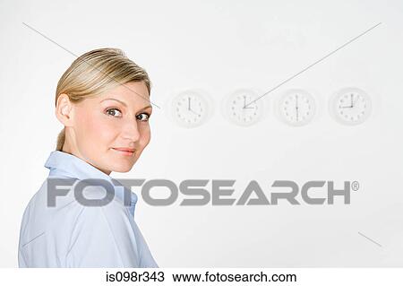 Businesswoman and clocks View Large Photo Image Stock Image - Businesswoman and clocks. Fotosearch
