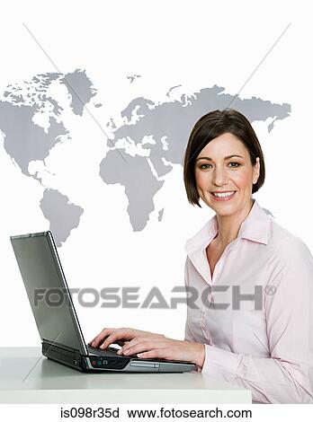 Stock Image - Businesswoman with laptop. Fotosearch