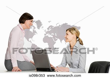 Businesswomen with laptop View Large Photo Image Stock Image - Businesswomen with laptop. Fotosearch