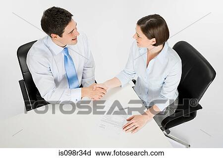 Colleagues shaking hands View Large Photo Image Stock Image - Colleagues shaking hands. Fotosearch