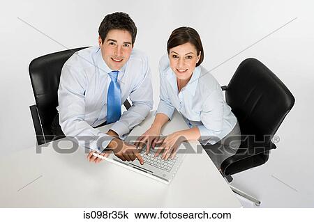Colleagues with laptop View Large Photo Image Stock Image - Colleagues with laptop. Fotosearch