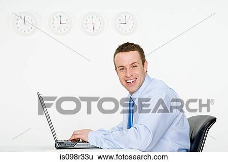 Office worker with laptop and wall clocks View Large Photo Image Stock Photograph - Office worker with laptop and wall clocks. Fotosearch