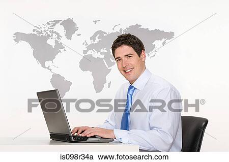 Office worker with laptop and world map View Large Photo Image Stock Image - Office worker with laptop and world map. Fotosearch