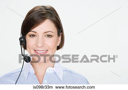 Woman wearing telephone headset View Large Photo Image Picture - Woman wearing telephone headset. Fotosearch
