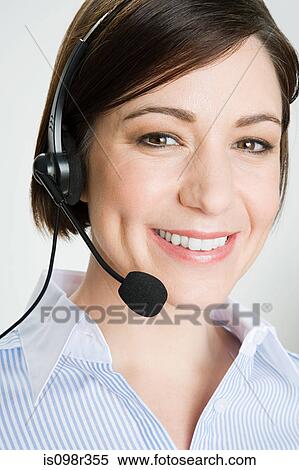 Woman wearing telephone headset View Large Photo Image Stock Photography - Woman wearing telephone headset. Fotosearch