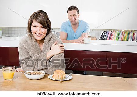 Stock Image - Couple having breakfast. Fotosearch