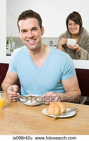 Stock Photograph - Couple having breakfast. Fotosearch