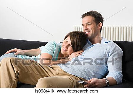 Couple watching television View Large Photo Image Stock Image - Couple watching television. Fotosearch