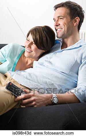 Couple watching television View Large Photo Image Stock Image - Couple watching television. Fotosearch