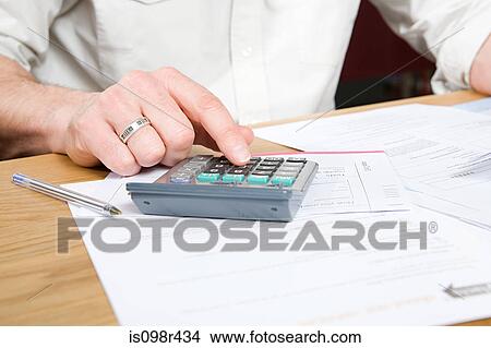 Person doing home finances View Large Photo Image Picture - Person doing home finances. Fotosearch