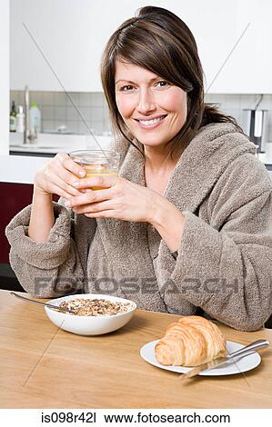 Woman having breakfast View Large Photo Image Stock Image - Woman having breakfast. Fotosearch