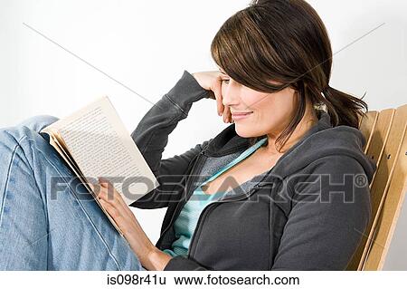 Woman reading book View Large Photo Image Stock Photograph - Woman reading book. Fotosearch