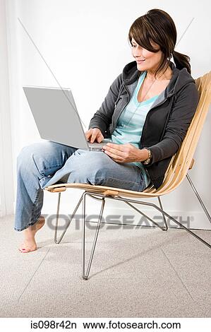 Woman using laptop View Large Photo Image Picture - Woman using laptop. Fotosearch