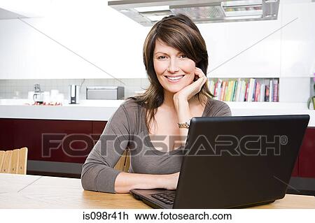 Woman with laptop View Large Photo Image Stock Image - Woman with laptop. Fotosearch