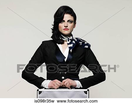 Stock Photo - Businesswoman holding briefcase. Fotosearch